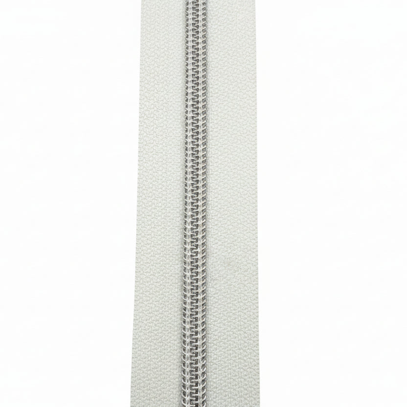 Glidelås metervare 6mm Spiral - Metalllook Sølv/Hvit (Pris oppgitt pr dm)