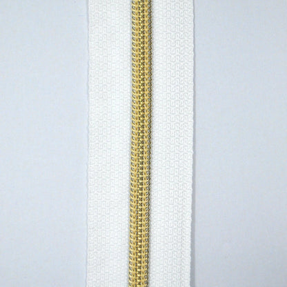 Glidelås metervare 6mm Spiral -  Metalllook Gull/Hvit (Pris oppgitt pr dm)