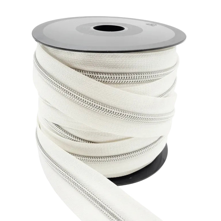 Glidelås metervare 6mm Spiral -  Metalllook Sølv/Hvit (Pris oppgitt pr dm)