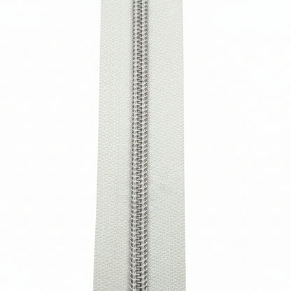 Glidelås metervare 6mm Spiral -  Metalllook Sølv/Hvit (Pris oppgitt pr dm)